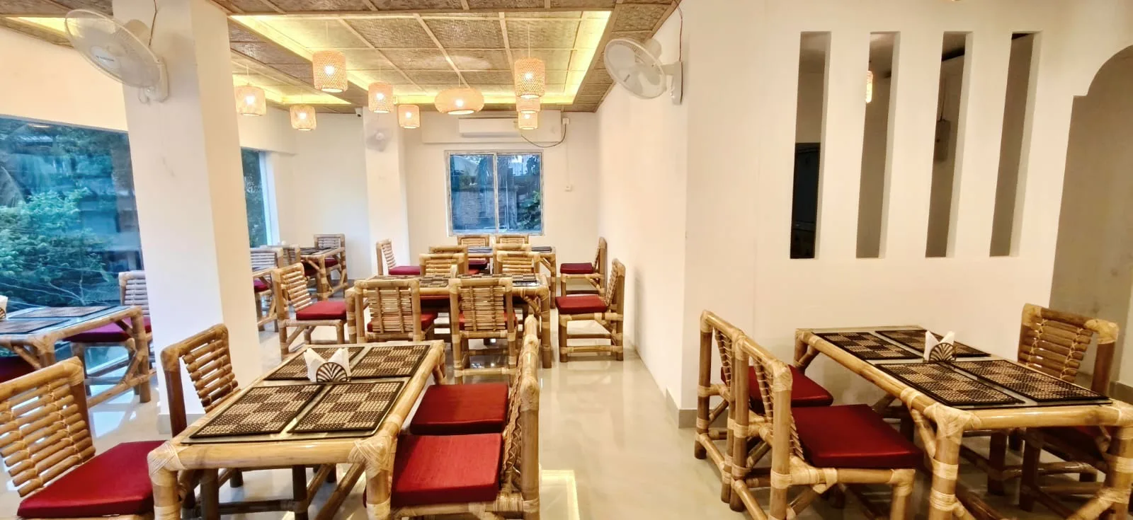 Bamboo tables with red cushions